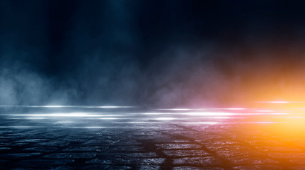 Wet asphalt, reflection of neon lights, a searchlight, smoke. Abstract light in a dark empty street with smoke, smog. Dark background scene of empty street, night view, night city.