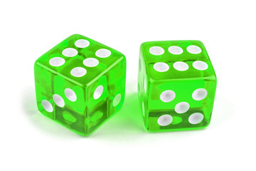 Two green glass dice isolated on white background. Six and six.