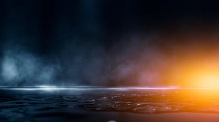 Fototapeta premium Wet asphalt, reflection of neon lights, a searchlight, smoke. Abstract light in a dark empty street with smoke, smog. Dark background scene of empty street, night view, night city.
