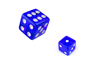 Two blue glass playing dice isolated on a white background. One and flying in the air, top view.