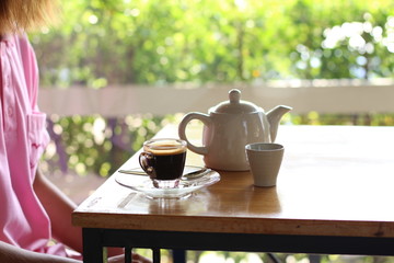 Black coffee with tea is placed on the table.