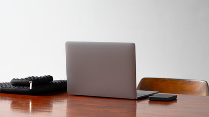 professional and clean workspace, including a hard drive with a black laptop case and protective hard drive case and a laptop. Photography, Creative, Blogging Workspace. Self-employed work area