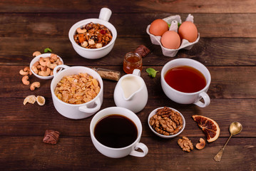 Tasty and useful breakfast with flakes, milk, nuts and dried fruits. The healthy food loading with energy