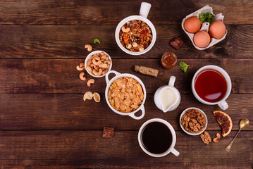 Tasty and useful breakfast with flakes, milk, nuts and dried fruits. The healthy food loading with energy