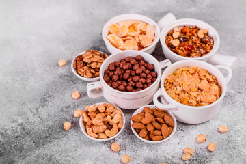 Tasty and useful breakfast with flakes, milk, nuts and dried fruits. The healthy food loading with energy