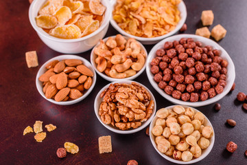 Tasty and useful breakfast with flakes, milk, nuts and dried fruits. The healthy food loading with energy