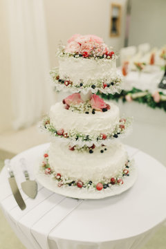 wedding cake on the table. Beautiful Colorful Sweet Wedding Cake Cupcake Decor Closeup Image at Event Space