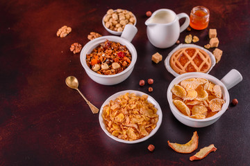 Tasty and useful breakfast with flakes, milk, nuts and dried fruits. The healthy food loading with energy