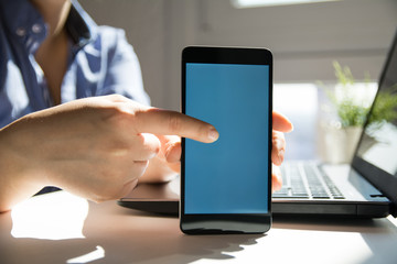 Close up of woman's hands using smart phone touchscreen