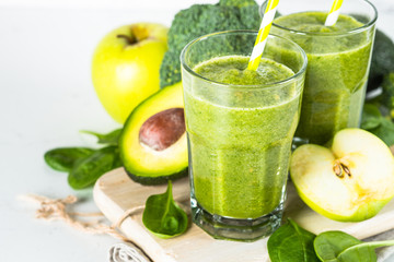 Green smoothie from fruit and vegetable on white.