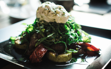 salad of grilled zucchini, mushrooms, sweet peppers with fresh arugula and goat cheese.