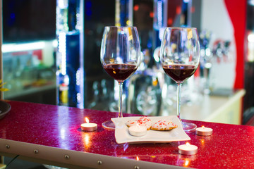 two glasses of wine and heart-shaped cookies. Valentine's Day