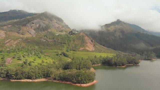 Aerial view beautiful nature with mountains and hills by Lake Mattupetty. Kerala State. Near the city of Munar.