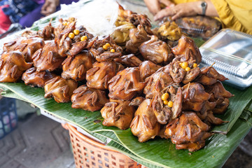 indonesian traditional food snack of grilled bacem quail chicken bird in the market