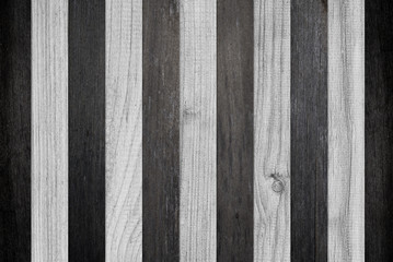 Black and white parquet with striped pattern. Texture of wooden boards. Composition of boards for wall decoration. Wooden planks, oak, for flooring. Wood texture for background.