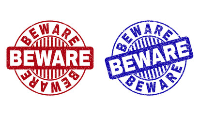 Grunge BEWARE round stamp seals isolated on a white background. Round seals with grunge texture in red and blue colors. Vector rubber imprint of BEWARE label inside circle form with stripes.