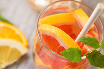 Infused water with fresh citrus fruits and ice