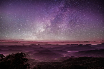 Milky way purple sky sunset with scenery beautiful romantic mountain hill and fog, other universe same earth, near earth,  explore the planet, planet, Solar System concept