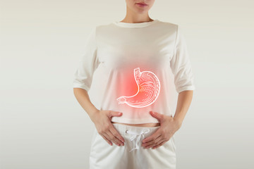 Digital composite of highlighted stomach of woman