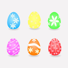 set of easter eggs painted with flowers on a gray background