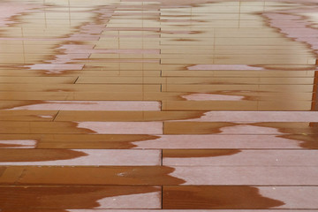wet wood floor with reflection