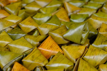 Thai dessert (Khanom Tien) wrapped in banana leaf