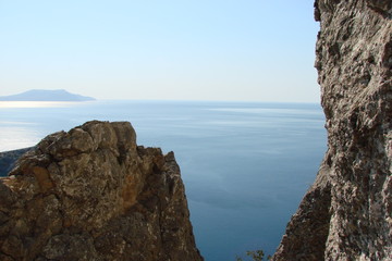 The landscape from the altitude of the rock of various shades of sea blue, connected on a horizon with the purity of the blue sky.