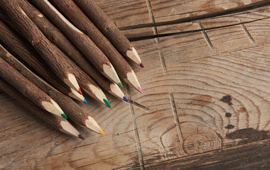 natural wood pencils on wooden background