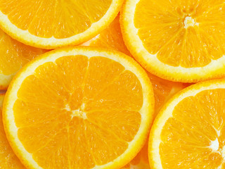 Close up shot of oranges slices random composition as background
