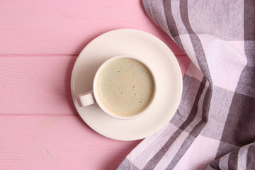 cup of coffee on wooden background top view.