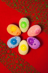 Decorative eggs on red background . Concepts Easter, eggs, hand made,