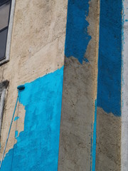 Painting a large wall in blue.