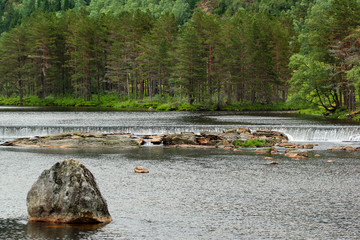 Water cascades on Sira river in Sirdal, Norway. Natural scandinavian landscape.