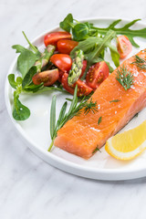 Serving cold smoked salmon fish, restaurant dish on plate