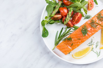Healthy dish, smoked salmon fish fillets with salad