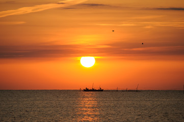 Fishermen traditional boat at sunrise 