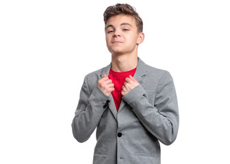 Handsome caucasian Teen Boy in suit isolated on white background. Teenager looking at camera. Happy...