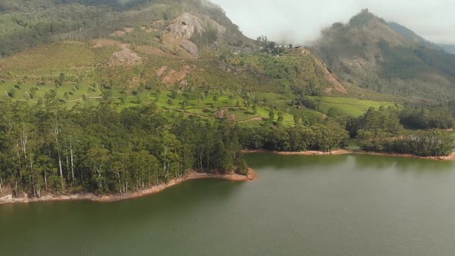 Aerial view beautiful nature with mountains and hills by Lake Mattupetty. Kerala State. Near the city of Munar.