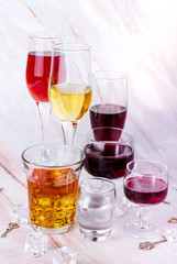 Wine card. Goblets with red and white whine, vodka and cognac