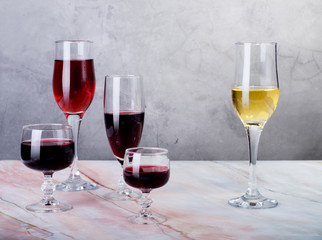 Wine card. Goblets with red and white whine.