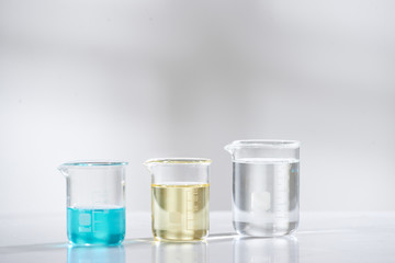 doctor woman scientist making herbal medicine in lab with herb leaves vitamin supplements mineral alternative treatment research.