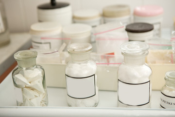  bottles for drugs with an empty space for text.