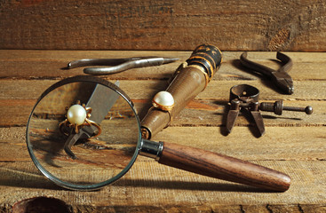 Pearl and gold ring and tools