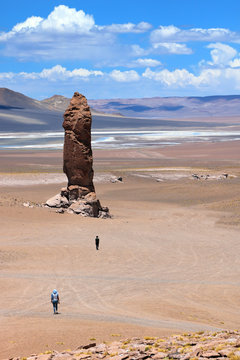 Giant rock in Atacama Chile with people