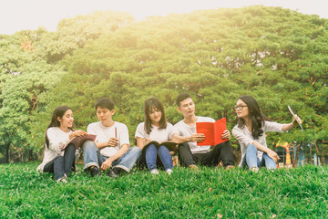 Asian student relax with friend in park for education concept