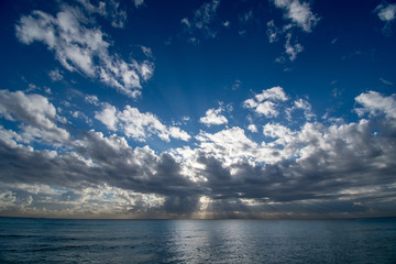 Naklejka na ściany i meble Sunrise over the ocean in Miami Beach with a cloudy sky