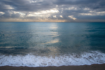Sunrise over the ocean in Miami Beach with a cloudy sky