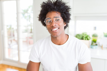 African American man wearing glasses with a happy and cool smile on face. Lucky person.