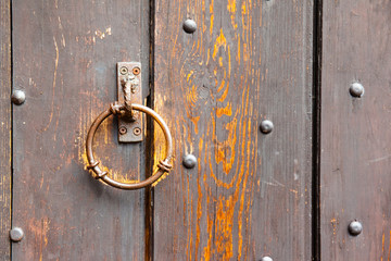 Fototapeta premium wooden surface with old door knocker