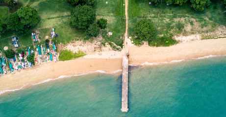 Aerial bird's eye view drone picture of the beach in East-Coast Park in Singapore - obrazy, fototapety, plakaty